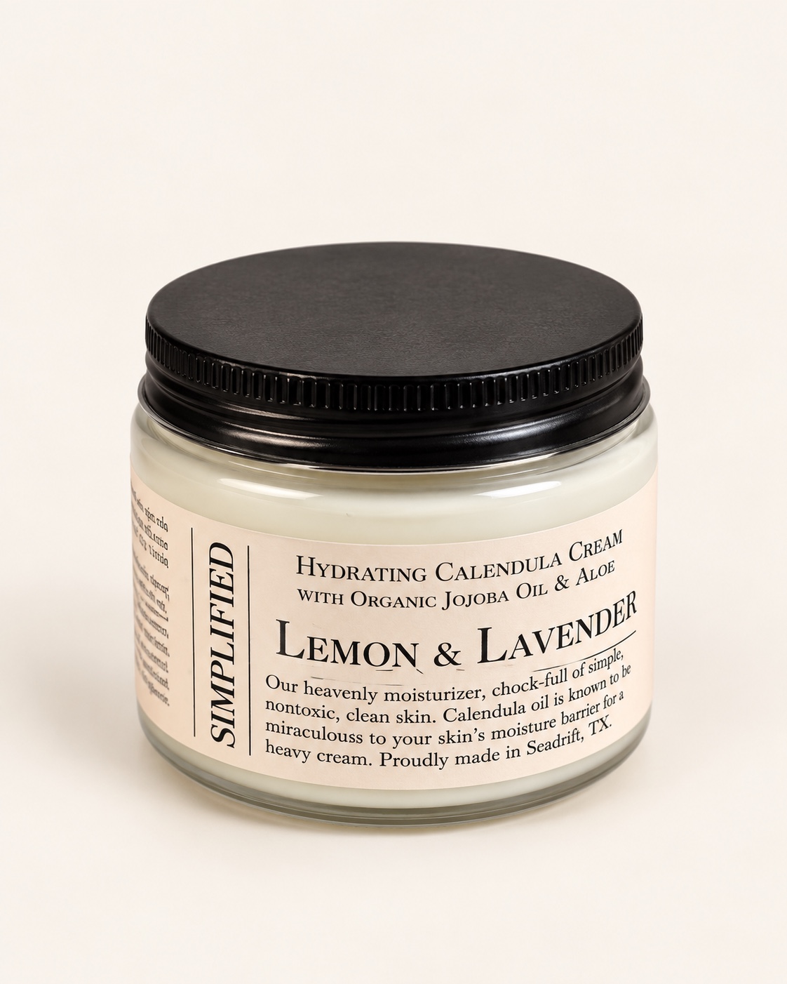 Lemon and Lavender Calendula Cream jar with a black screw lid.